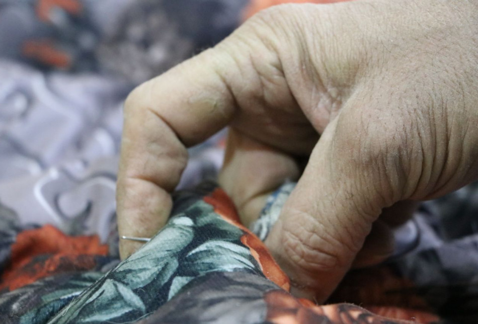Talib Ahmed makes cotton and wool mattresses in Mosul, Ninewa province.